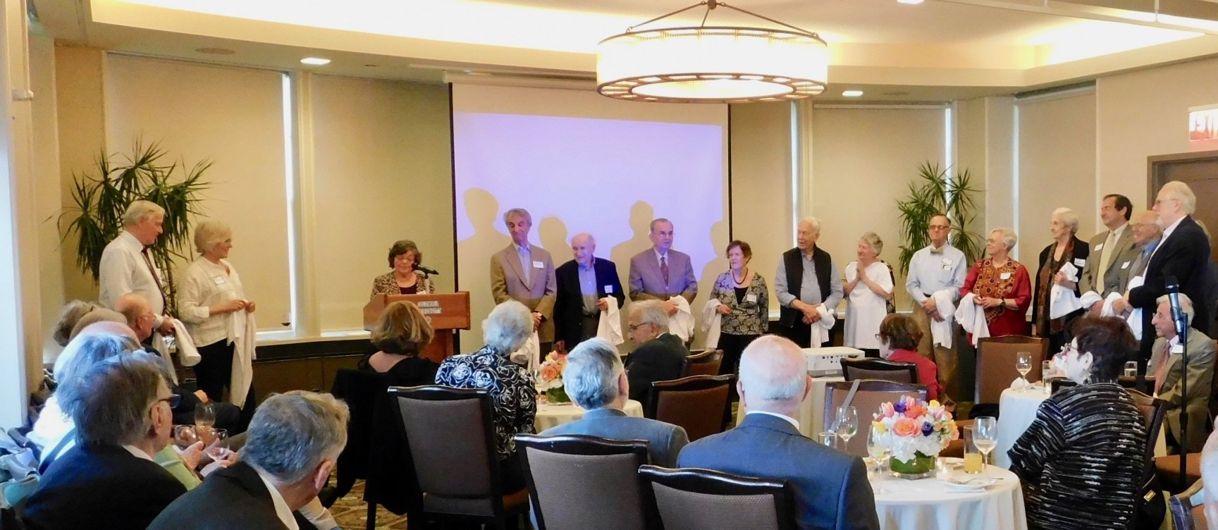 EPIC Executive Committee Members being recognized at the Annual Reception in front of the attendees