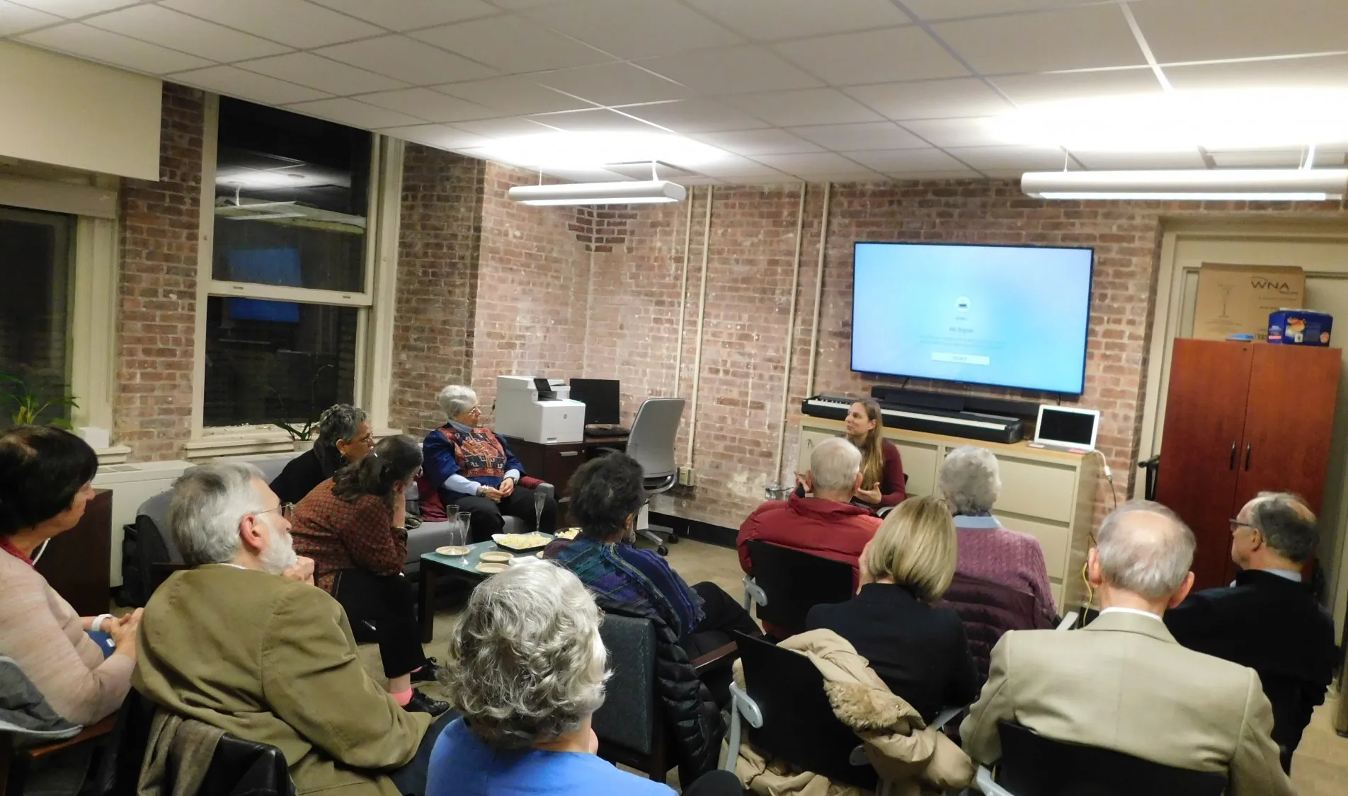 Discussion with Film Director Anna Moot-Levin after screening of her movie, a dozen EPIC members sitting down
