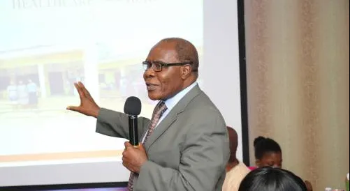 Prof Emeritus Ofodile making a presentation to people sitting down