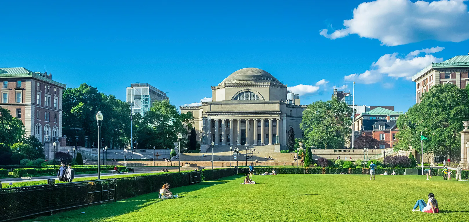 Low Library Building and people sitting on the green lawn